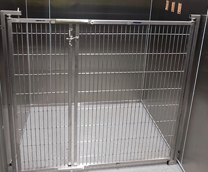 A metal cage with a door